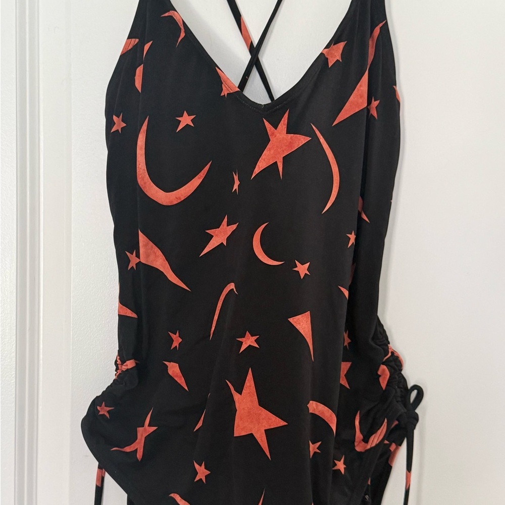 BCBGeneration Black bathing suit  with Reddish orange Star and moon  Print